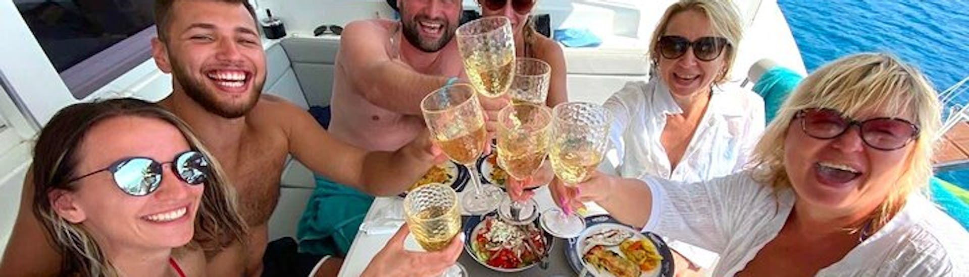 Happy people taking an aperitif during their Catamaran Trip to Dia Island from Heraklion.