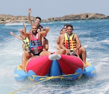 People smiling on the Inflatable rented from St. Nicholas Beach Watersports.