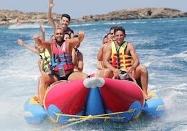 People smiling on the Inflatable rented from St. Nicholas Beach Watersports.