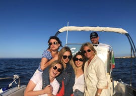 Picture of a group of people on a boat from Escursioni Sofia Polignano during the Boat Trip to the Sea Caves of Polignano a Mare.