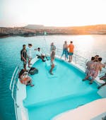People watching the sunset from the boat during the Sunset Boat Trip to Cape Greco from Pernera & Protaras with Aphrodite I Cruises Cyprus.