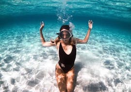 A woman under water during the Private Boat Trip to the Balos Lagoon & Falasarna from Kissamos with Chania Balos Cruises.