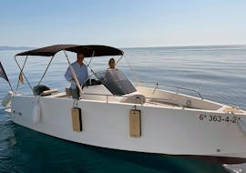 A couple in the sea during a Boat Rental in Marbella (up to 7 people) with Royal Catamaran.