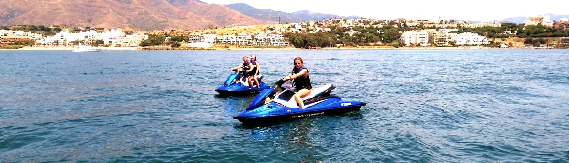 A group of participants having fun while driving around on a jet ski hire from Estepona with South Olé Sails.