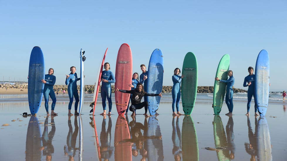 A group of people with surfboards during a surf lesson in Praia do Tarquínio with Gota Dagua Surf School.