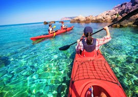 Friends on a kayak on the sea, rented from the kayak rental in Umag with Levante Watersports Umag.