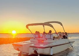 A boat on the sea during the beautiful Sunset Boat Trip from Faro along the Ria Formosa from Lands - Eco Boat Tours.