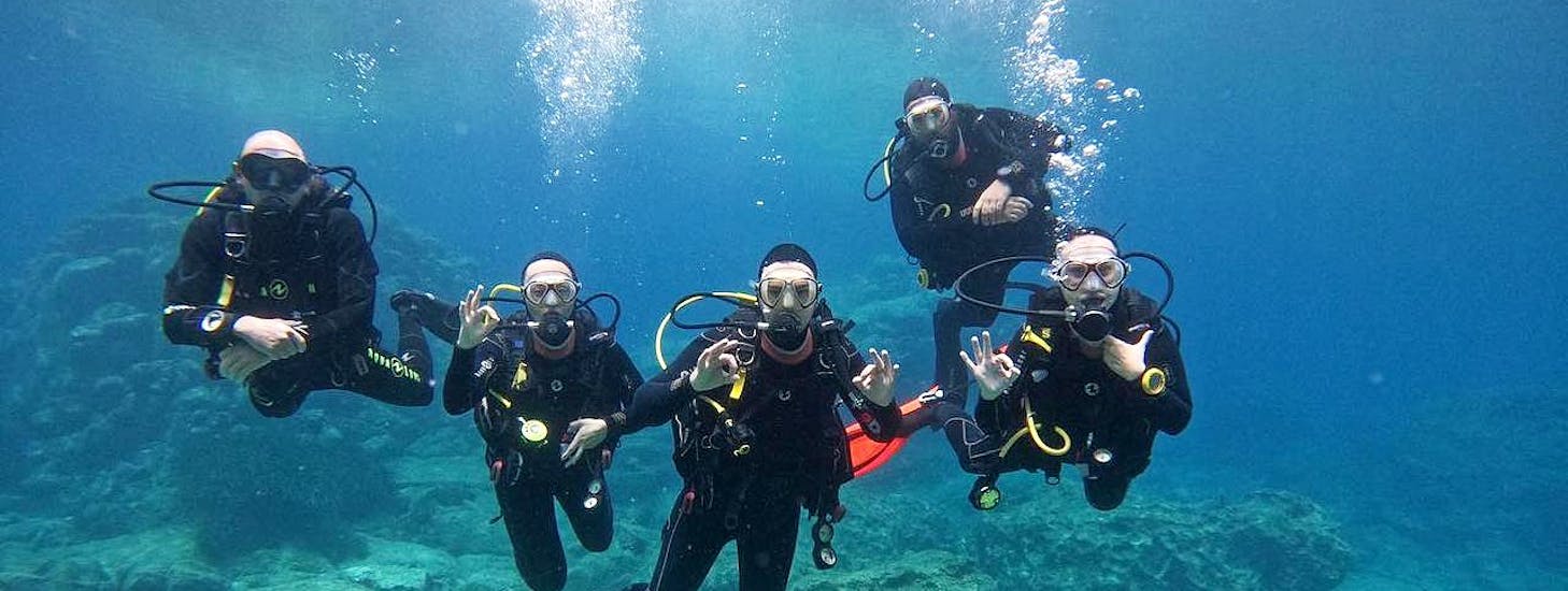 Picture of a group of divers posing underwater during a course with Cyprus Diving Adventures.