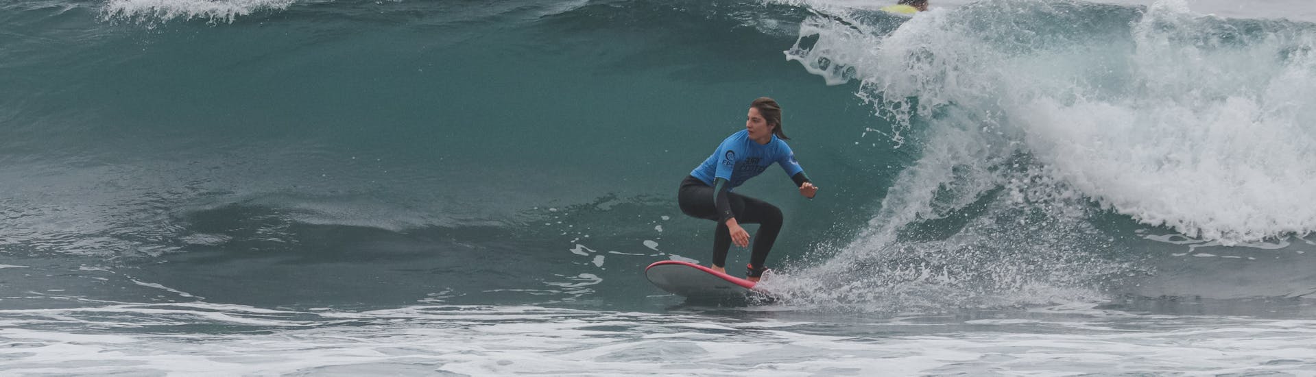 A person surfing during a private surf lesson on Praia do Matadouro with Boardculture Surf Center.