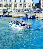 Picture of a boat from 18 Isola Bella Ortigia in the port of Syracuse during the Boat Trip to Ortigia and the Sea Caves.