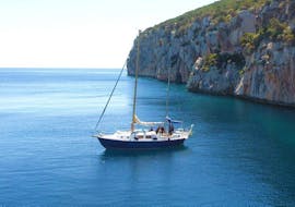 Our sailboat spotted during a sailing trip from Alghero along the coast with sunset aperitif with Coral Sail Alghero.