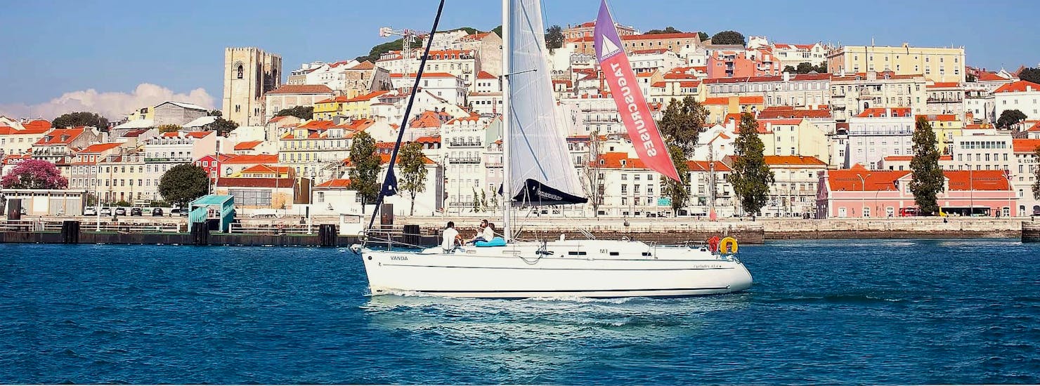 A group of participants having fun on a sailboat along the Tagus river during a morning boat trip in Lisbon with Taguscruises Lisbon.