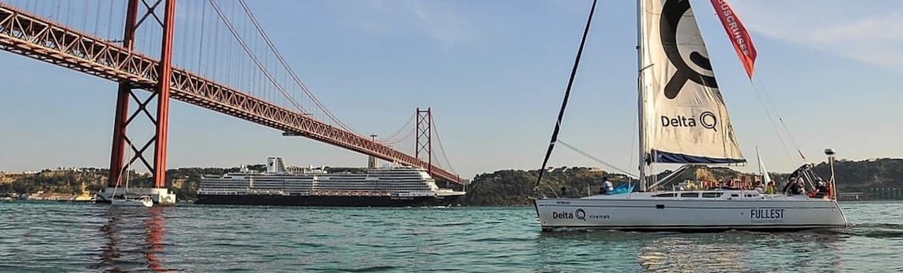 The beautiful city of Lisbon as background, while an elegant sailboat sails to a nearby beach during a private boat trip from Lisbon with Taguscruises Lisbon.