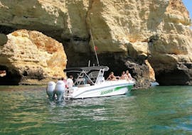 Our boat visiting a cave during a Private Boat Trip on the Arade River from Portimão with SeaSiren Tours Algarve.