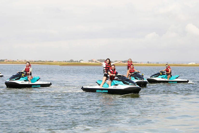 A group of participants during a fun stop along the Guadiana River during a ski safari along the river between Spain and Portugal with Jet Ski Dreams Huelva.