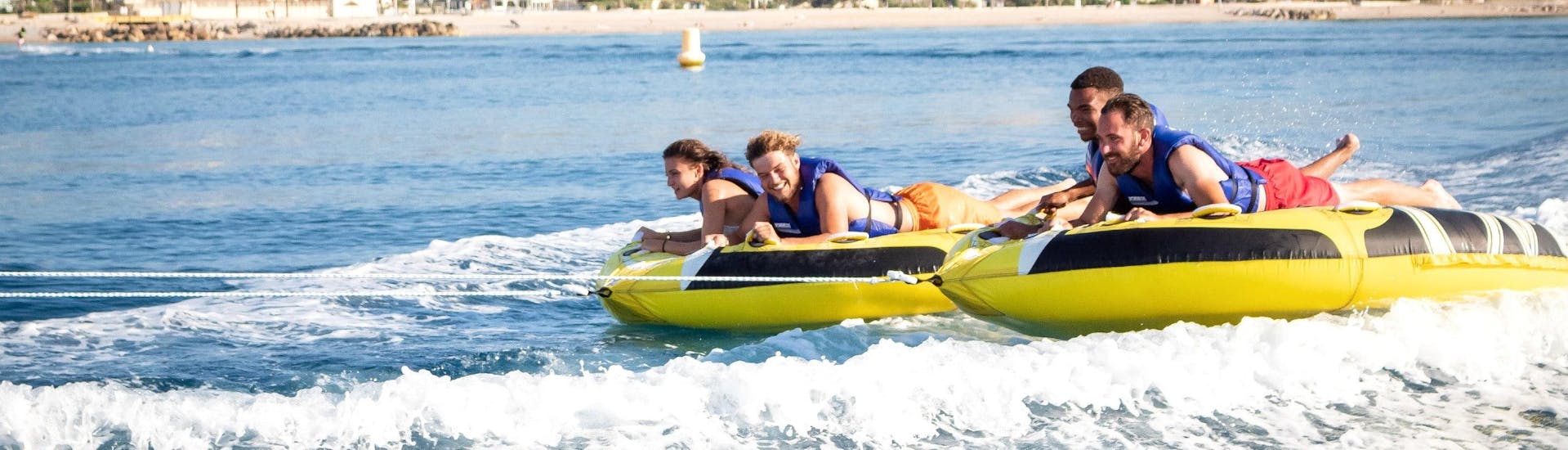 Friends are having fun on their ride with an Sofa Ride and More Towable Tubes in Cagnes-sur-Mer with Cagnes Watersports.