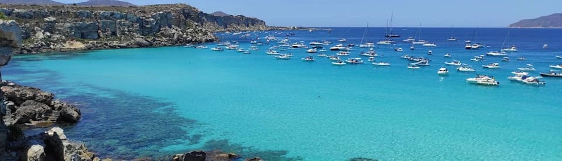 A beautiful beach in the Egadi archipelago to visit during a private boat trip from Trapani to Favignana and Levanzo with Egadi Sea & Boat.