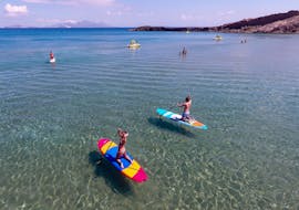 People on the SUP from the SUP Hire at Paradise Beach in Kos with Water Club Paradise Beach Kos.