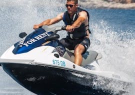 Picture of a man flying over the water with a jet ski rented from Dubrovnik Islands Tours.