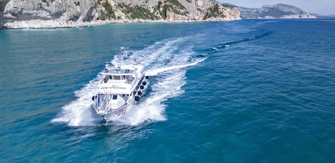 The boat is navigating around the gulf during the Boat Trip in the Gulf of Orosei with Dovesesto Cala Gonone.