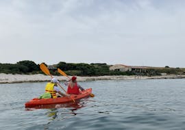 Two people on a kayak with life vest during the sea kayaking tour to Bodulaš and Ceja from Medulin with Acqua Life Medulin.