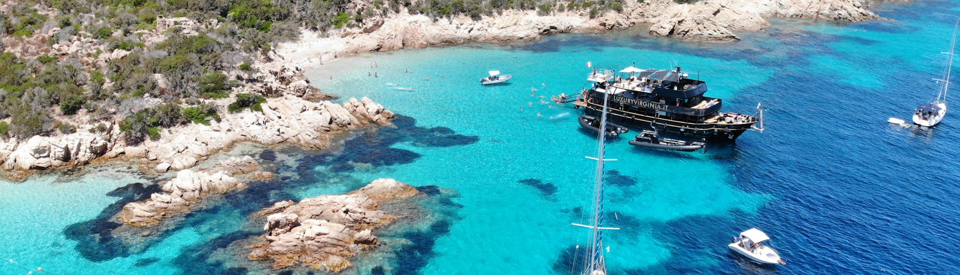 Our boat is stopping for one of the swimming stops during the Luxury Boat Trip from Cannigione and Baja Sardinia to La Maddalena.