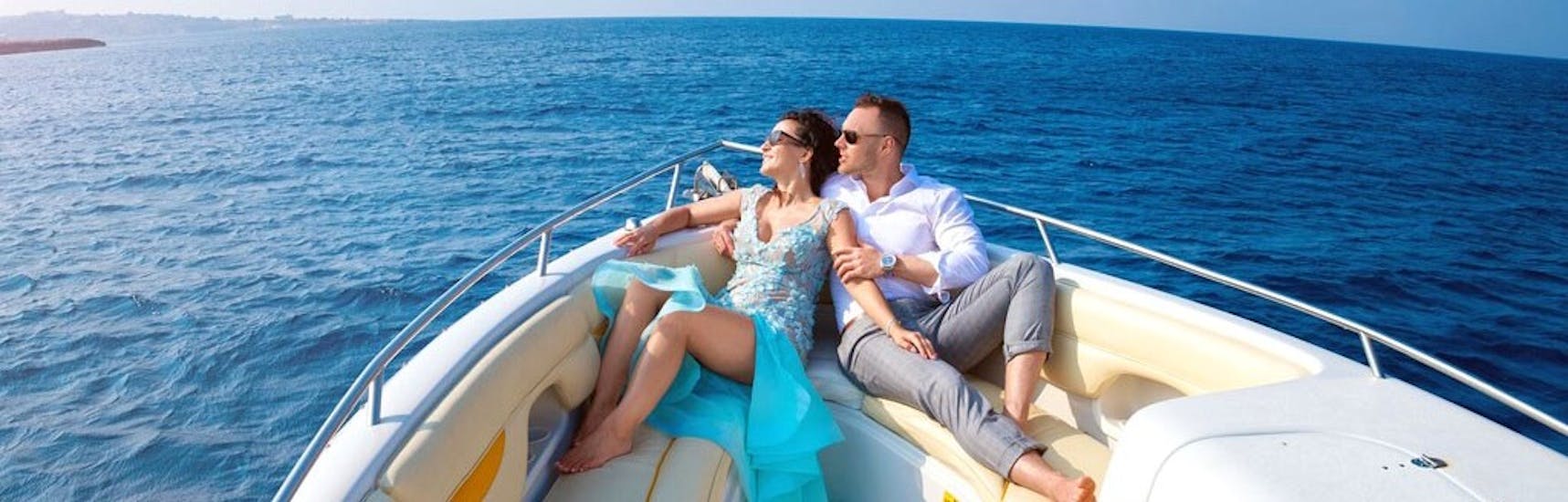 Couple enjoying the private boat trip to Cape Greco & Blue Lagoon with snorkeling with Ayia Napa Charters.