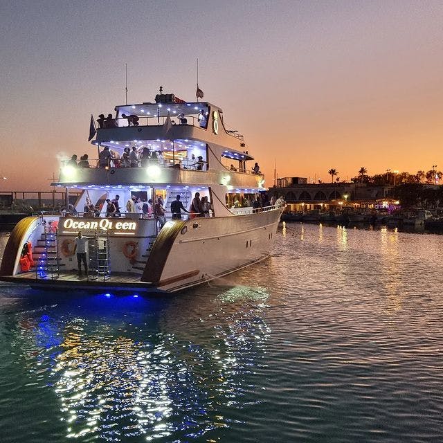 Luxury boat used on the Luxury Sunset Boat Trip to the Blue Lagoon from Ayia Napa with Ocean Queen Ayia Napa in the harbour at night.