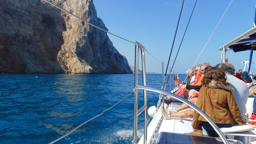 Participants having fun on board an eco sailing catamaran during a sailing boat trip along the Bay of Malaga with Mundo Marino Costa del Sol.