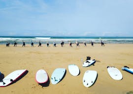 A group of people warming up during an intensive surf lessons in Vila Nova de Milfontes with Alentejo Surf School.