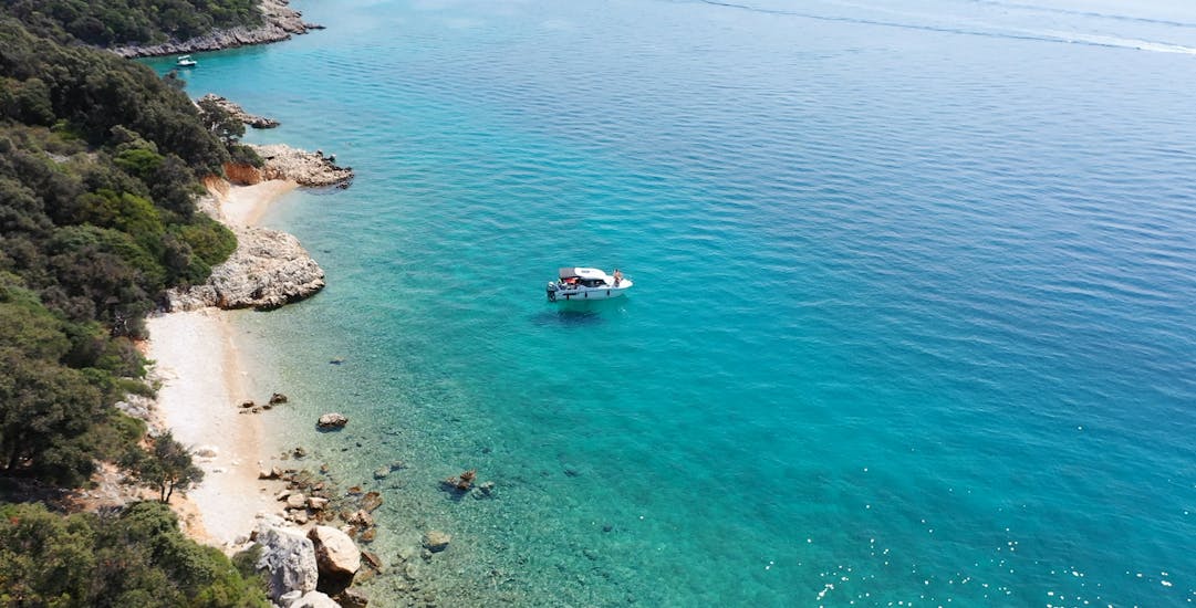 A boat from the Boat Rental in Krk (up to 9 people) in the water with Rent a Boat & Jetski Krk.