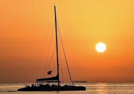 Beautiful sunset landscape on the Mediterranean Sea while on a catamaran trip in Valencia with Mundo Marino. 