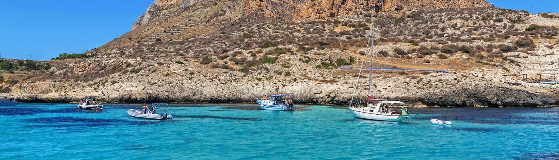 Breathtaking scenery of the Egadi archipelago during a boat trip from San Vito Lo Capo to Favignana and Levanzo with Egadi Navigazione.