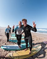 2 young people enjoying their Private Surf Lessons in Cascais near Lisbon with Papaya Surf Camps.