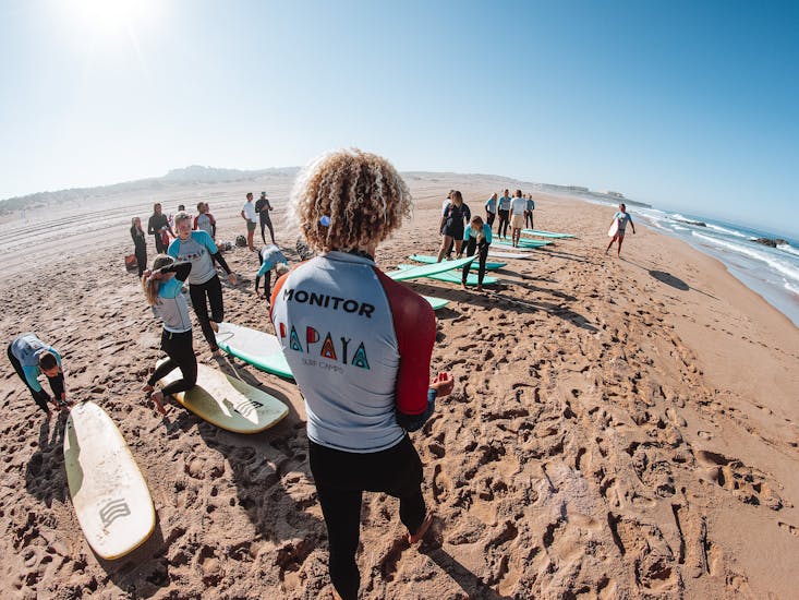 The instructor is monitoring the students during the Private Surf Lessons in Cascais near Lisbon with Papaya Surf Camp.