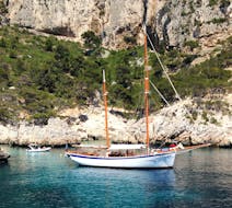 Our boat La Goélette Alliance anchored in a creek during the Sailing Trip to the Calanques of Marseille with Snorkeling.