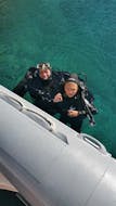 A child and an adult smile into the camera from the water during the SSI Open Water Diver Course in Krk for Beginner with Diver Krk.