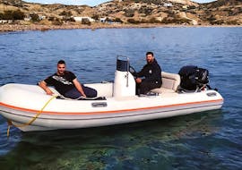 Client and skipper on a RIB boat in the private RIB boat trip from Agia Kiriaki to Kleftiko with Indigo Yacht Milos.