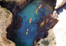 Aerial view of a group during their sea kayaking around Ponta da Piedade with boat transfer from Lagos with Blue Fleet Lagos.