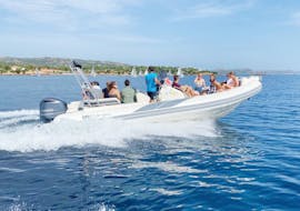A group of friends enjoy a private RIB boat trip from Cannigione to the La Maddalena archipelago with Noleggio Le Isole Cannigione.