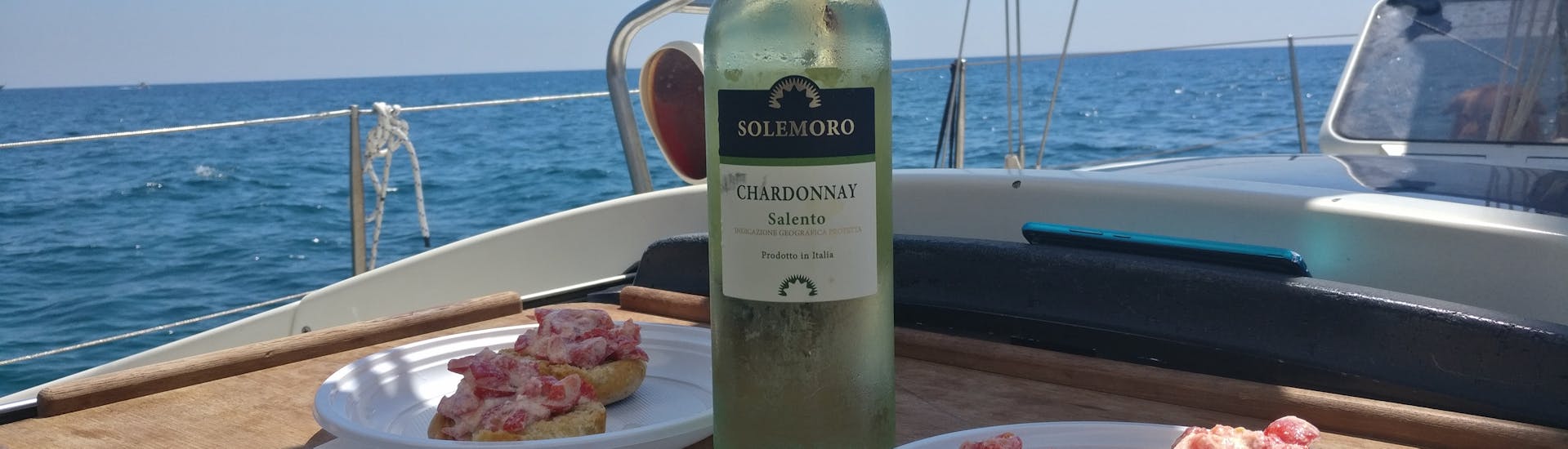 Picture of the apéritif offered on board by 40° Parallelo Leuca during the Private Boat Trip from Leuca to the Coast of Salento.