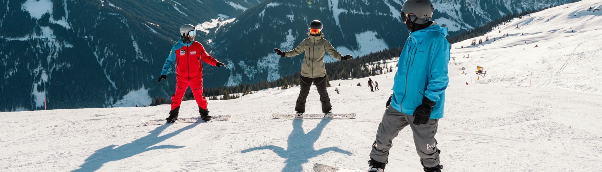 People doing Snowboarding Lessons for Adults (from 15 y.) of All Levels.