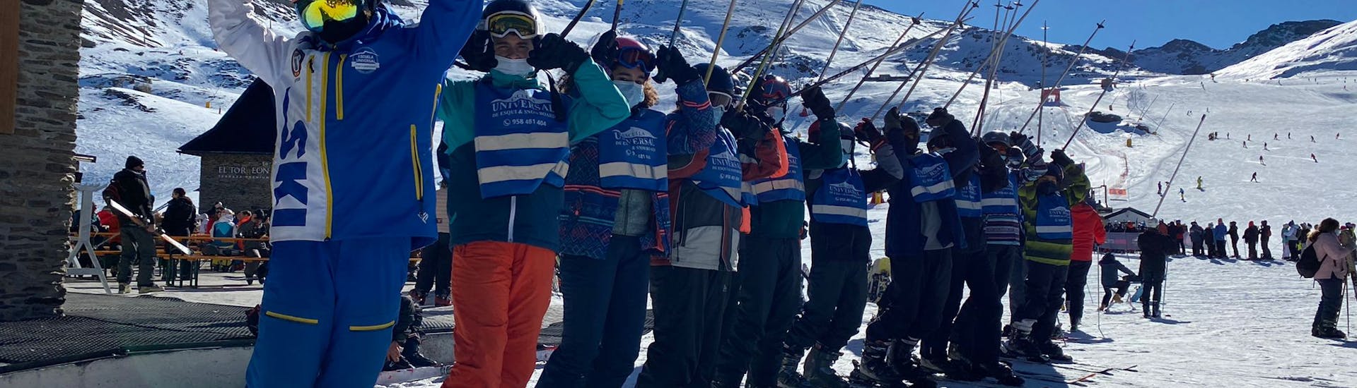 Students learn to ski during a ski lesson for beginners with Escuela Universal de Ski Sierra Nevada.
