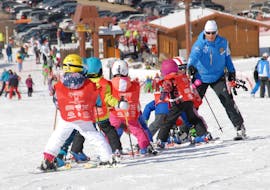 Kids having fun during their Kids Ski Lessons (4-5 y.) for Beginners with Scuola Italiana Sci Folgaria - Serrada.