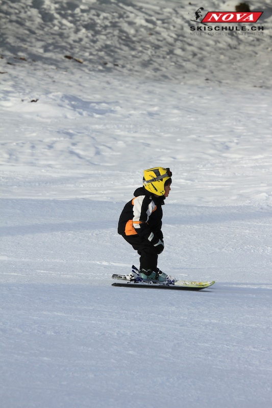 Student skiing down in snow plough during private ski lessons for kids with skischool Nova.
