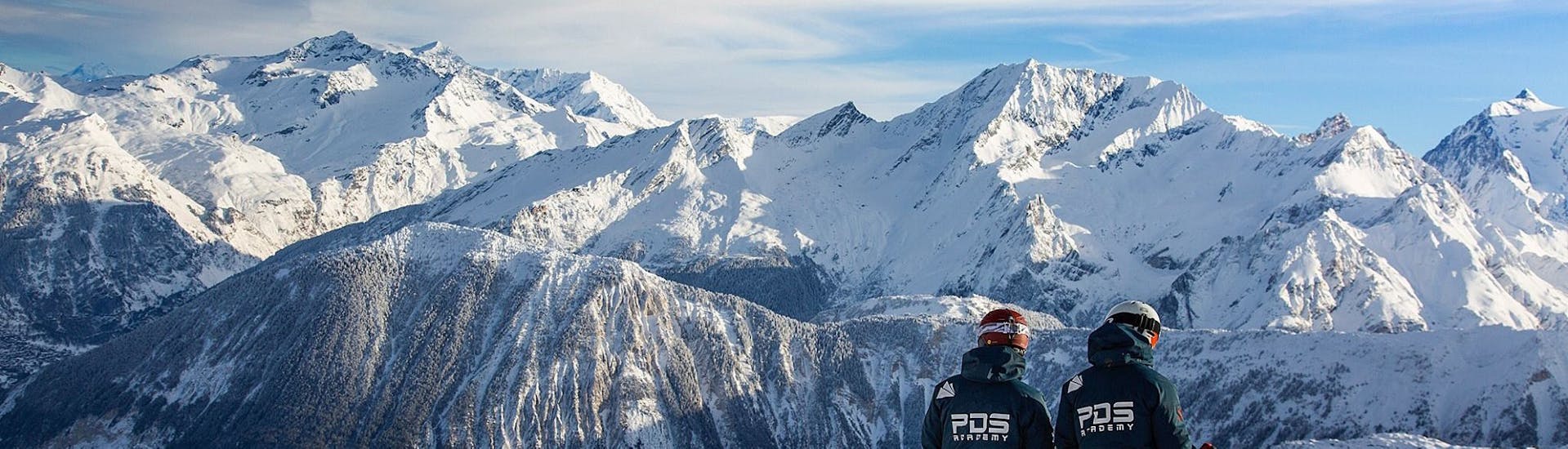 Two instructors of PDS Snowsport are looking at the mountain before starting their Private Snowboarding Lessons for Kids & Adults of All Levels.