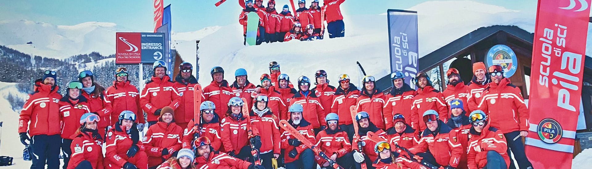 The instructors from Scuola di Sci Pila pose together in front of the camera after the Adult Ski Lessons for All Levels.