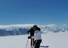 2 participants of the Adult Ski Lessons (from 16 y.) for First Timers make their first braking attempts with the Grächen Ski School - Zenklusen Sport.