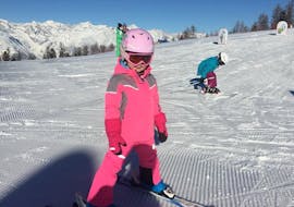 A kid is having fun during the Private Ski Lessons for Kids (4-16 y.) of All Levels with Skischule Grächen - Zenklusen Sport.