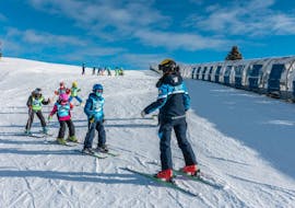 Group of kids during the Kids Ski Lessons (5-12 y.)  for Experienced Skiers with Scuola Sci Scie di Passione Folgaria.